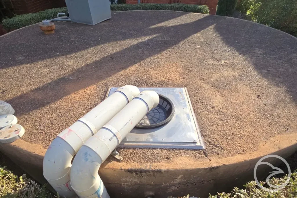 Stormwater detention infrastructure integrated into an urban drainage system